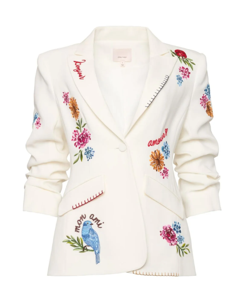 White blazer with colorful floral and bird embroidery on a white background