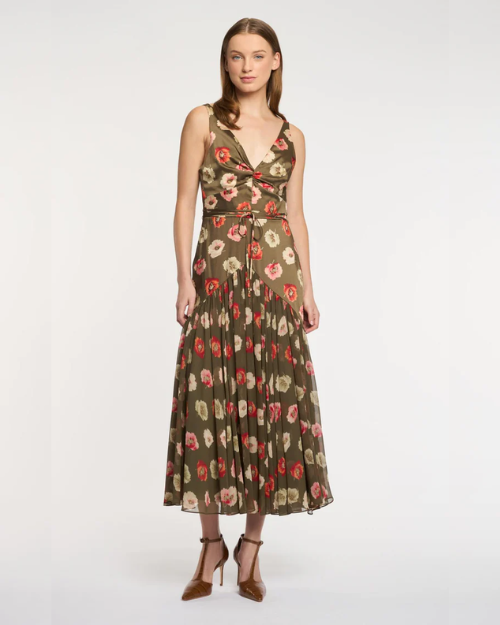 Woman wearing a floral dress on a white background