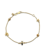 Gold bracelet with bee and flower designs on a white background