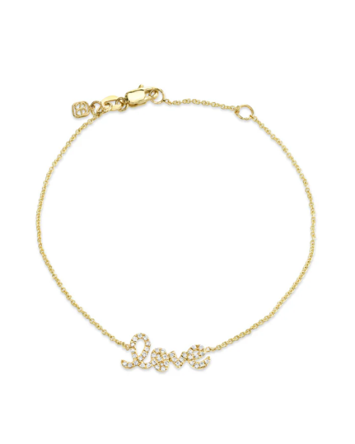 Gold bracelet with 'LOVE' script on a white background