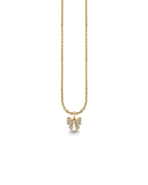 Gold necklace with a bow pendant on a white background