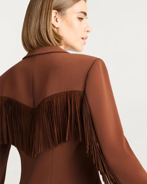 Brown fringed jacket worn by a person on a white background