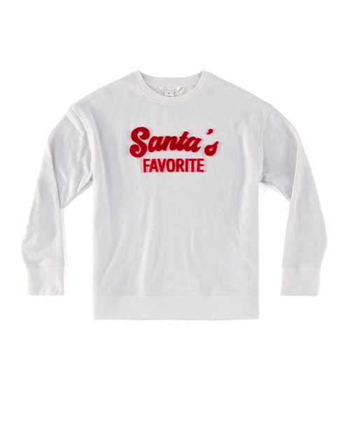 A white long-sleeved sweatshirt with the phrase ‘Santa’s FAVORITE’ printed across the chest in red, stylized font. The background is plain and highlights the sweatshirt.