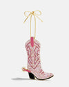  A pink cowboy boot ornament with a gold chain, designed for hanging on a Christmas tree.