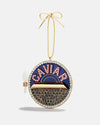 A decorative Christmas ornament in gold and blue, labeled with the word "caviar," resembling a caviar container.