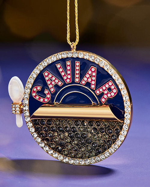 A Christmas tree ornament, displaying the word "caviar."