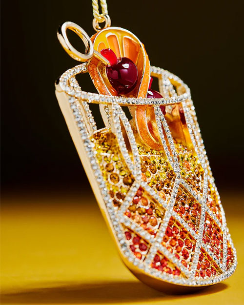 A colorful Christmas ornament depicting a cocktail in a glass, blending holiday cheer with a fun drink theme.