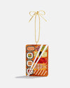 A Christmas ornament featuring a colorful sushi design, blending holiday cheer with a unique culinary theme.