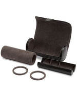 A sleek black leather watch case opened showcasing the Ultrasuede lining, patented watch guards. and a hidden jewelry capsule with 3 compartments.  
