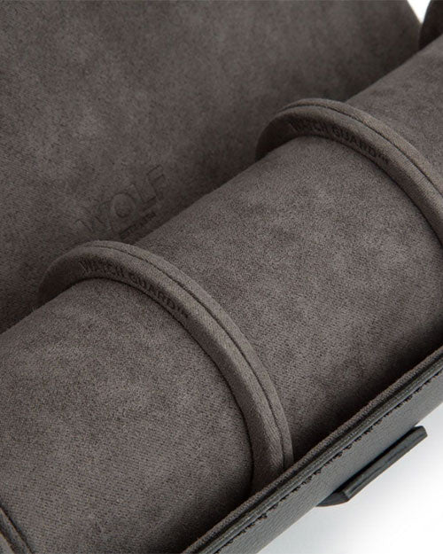 Up-close image of the watch roll and watch guards showing the leather and Ultrasuede 