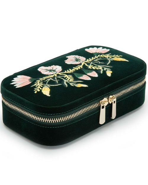 A luxurious forest green velvet case featuring delicate floral embroidery, highlighting its artistic design and rich texture.