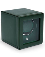 A green leather box containing a watch winder, designed to care for your watch with ease.