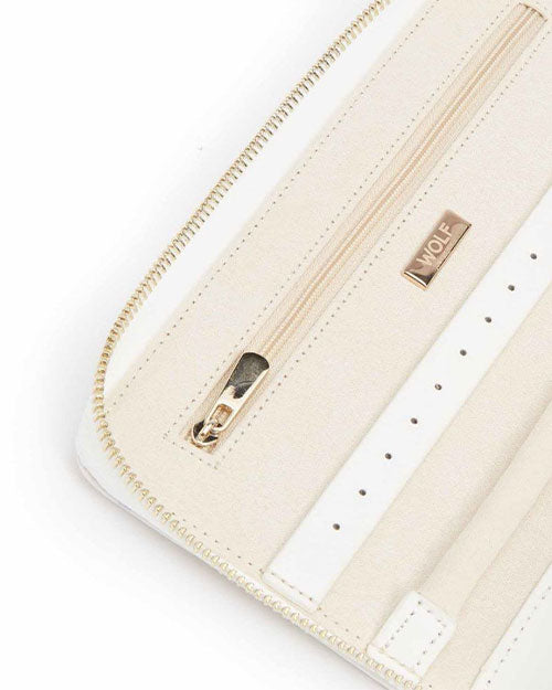 Up-close image of a zipper compartment and earring tab. 