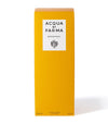 Acqua Parma diffuser presented in a yellow box, showcasing an elegant glass bottle diffuser inside.

