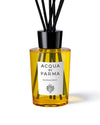Acqua Parma diffuser displayed in an elegant glass bottle with natural reeds for fragrance diffusion.