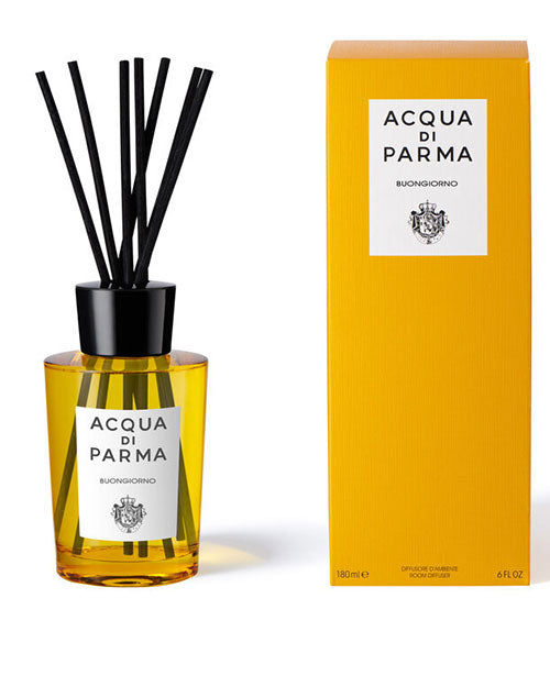 Acqua Parma diffuser displayed in an elegant glass bottle with natural reeds for fragrance diffusion.