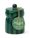 A Balsam Fir candle with a decorative blue and green striped lid, perfect for creating a cozy atmosphere.