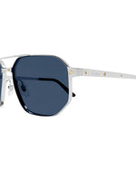A pair of Cartier sunglasses with a silver frame and dark blue lenses. The frame has gold screw details on the arms, and the Cartier logo is engraved on the side of the arm.