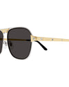 A pair of sunglasses with dark lenses and a metallic frame. The temples of the sunglasses are gold-colored with visible screws and the brand name 'Cartier' engraved on the side.