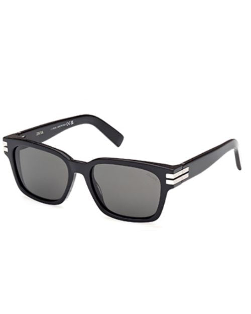 Black sunglasses featuring a sleek silver frame, showcasing a modern and stylish design.