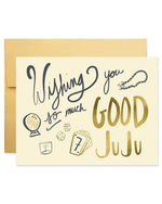 A greeting card featuring the phrase "Wishing you so much good juju" in colorful, playful typography against a bright background.