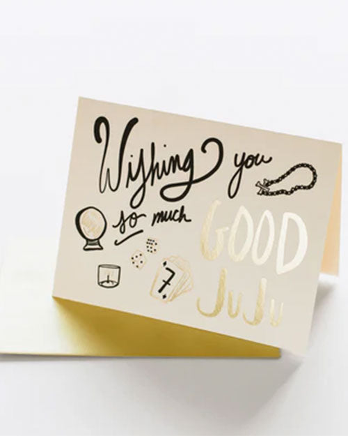 A vibrant card displaying the message "Wishing you so much good juju" in cheerful lettering, surrounded by decorative elements.