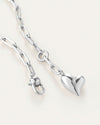 A silver heart necklace featuring a delicate chain, elegantly designed for a timeless look.