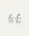 A pair of silver earrings, that make a bold statement by complementing not competing with your outfit.