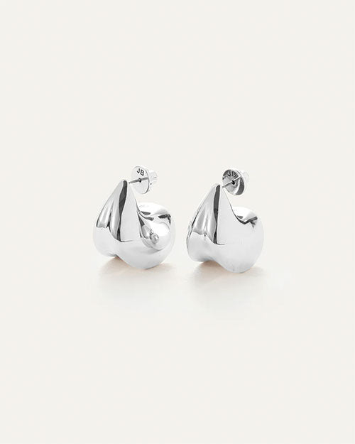 A pair of silver earrings, that make a bold statement by complementing not competing with your outfit.