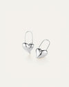 A pair of silver heart-shaped earrings