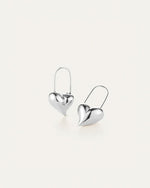 A pair of silver heart-shaped earrings