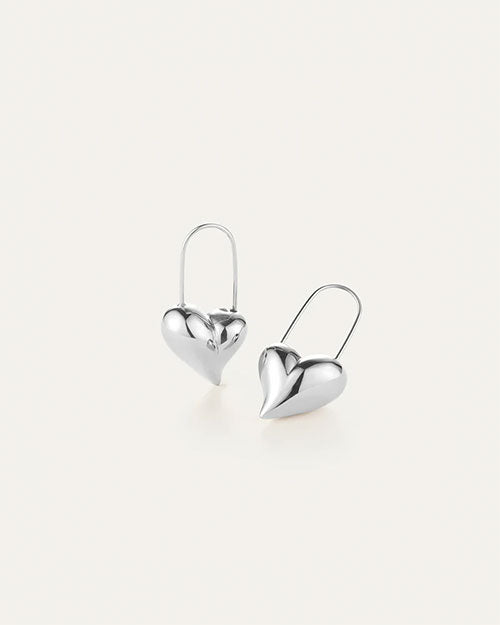 A pair of silver heart-shaped earrings