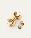 Gold plated earrings displayed alongside a matching pair, showcasing their elegant design and shiny finish.