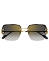 A frontal view of a folded pair of Cartier sunglasses with a gold, slanted square frame and gradient lenses against a white background. The brand name "Cartier" is visible on the right left lens.