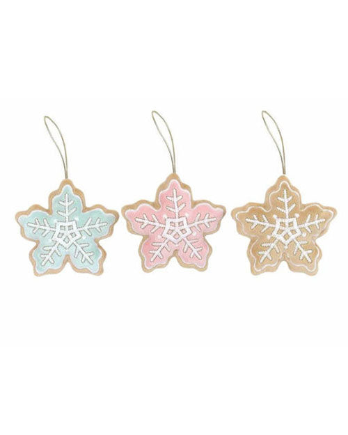 Three plush snowflake ornaments designed as frosted cookies in different colors. The background is plain white.