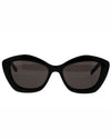 A pair of black cat eye sunglasses, featuring a stylish and bold design.