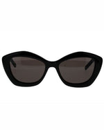 A pair of black cat eye sunglasses, featuring a stylish and bold design.
