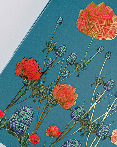 Floral pattern in blue and red against a solid blue background.