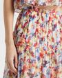 Multicolored floral skirt with a white background