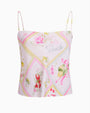 A pink and yellow floral print top, featuring vibrant colors and a stylish design.
