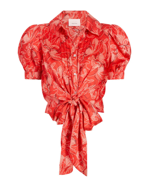 Red patterned blouse with puff sleeves on a white background