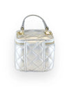 Back view of a small metallic silver quilted vanity-style handbag with a top handle, gold-tone hardware, and a plain diamond-stitched design featuring a vertical strap detail.