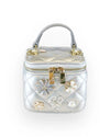 Small metallic silver quilted vanity-style handbag with a top handle, gold-tone hardware, and decorative floral embellishments in silver, white, and crystal accents on the front.