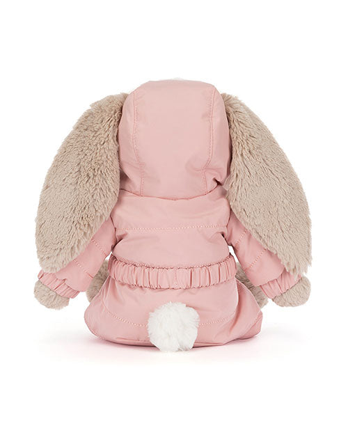 Back view of a plush bunny toy wearing a pink hooded jacket with beige floppy ears and a white fluffy tail, featuring elastic bands around the waist and cuffs.