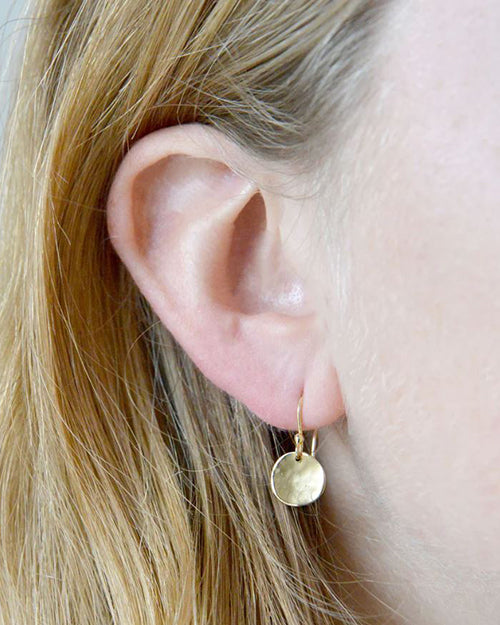 Model wearing Petite Gold Round Disc Earrings.