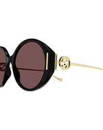 Side close up view. GG Interlocking sunglasses on white background.