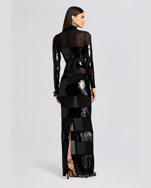 A back view of a long-sleeved, floor-length dress with horizontal panels of black and shiny sequins creating a striped pattern. The dress features a high neckline and has a back slit.