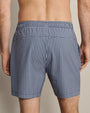 Back view of navy and white gingham swim trunks featuring a classic check pattern, lightweight quick-dry fabric, and relaxed fit.