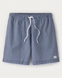 Navy and white gingham swim trunks with an elastic waistband, white drawstring closure, and relaxed fit displayed on a light gray background.
