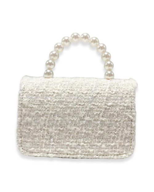 The backside of a girl's ivory tweed purse with a large pearl handle